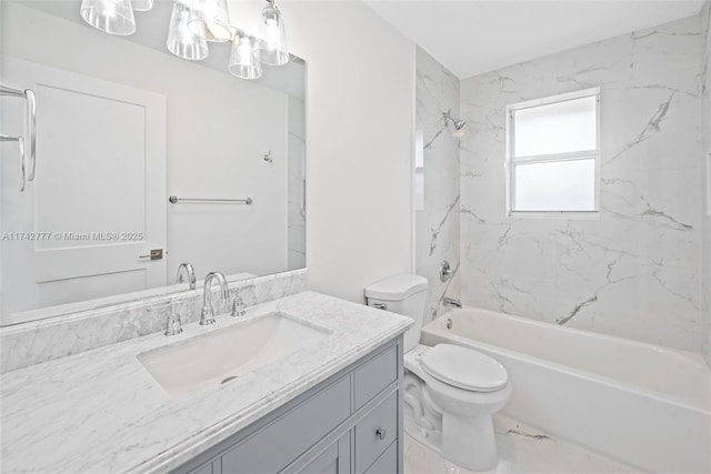 full bathroom with vanity, tiled shower / bath combo, and toilet