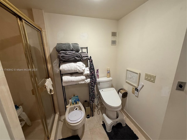 bathroom with an enclosed shower, tile patterned flooring, and toilet