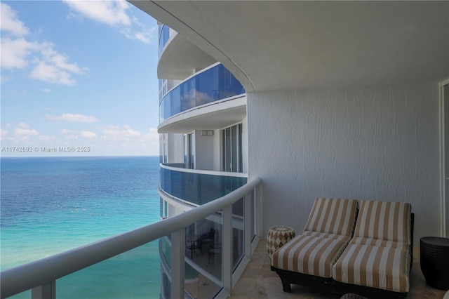 balcony featuring a water view