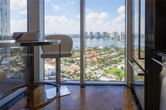 unfurnished dining area with plenty of natural light and a water view