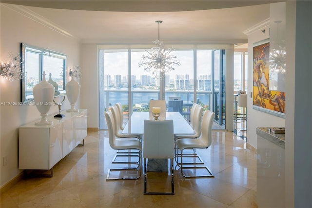 dining room featuring crown molding, floor to ceiling windows, and a chandelier