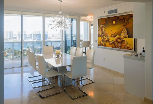 dining space featuring an inviting chandelier, floor to ceiling windows, crown molding, and light tile patterned floors