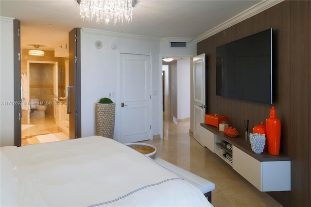 bedroom featuring crown molding and ensuite bathroom