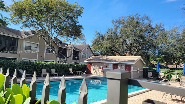 view of swimming pool featuring a patio area