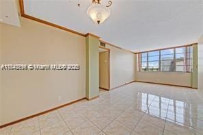 unfurnished room with tile patterned floors