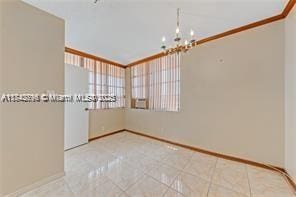 unfurnished room featuring tile patterned flooring