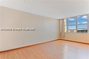 empty room featuring hardwood / wood-style flooring