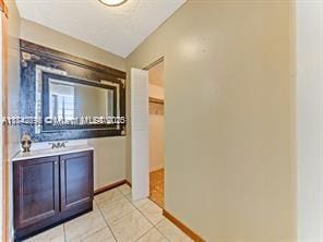 bathroom with sink and light tile patterned floors