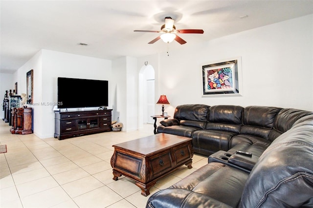 living room featuring light tile patterned floors and ceiling fan