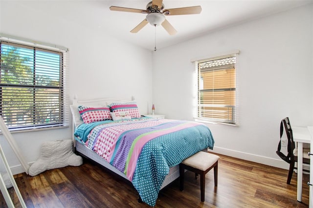 bedroom featuring dark hardwood / wood-style flooring and ceiling fan