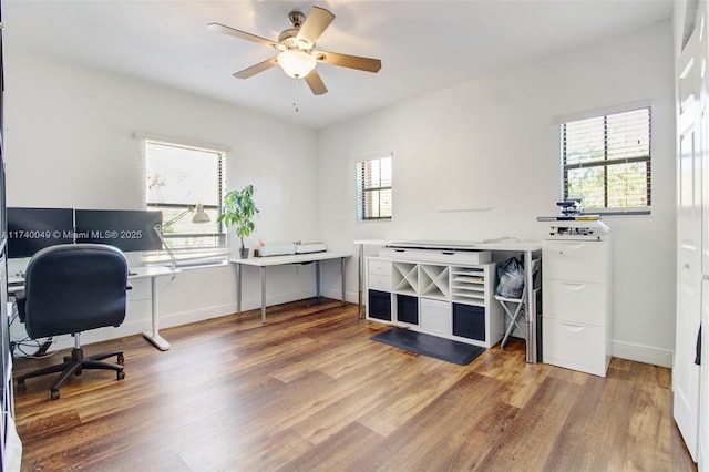 home office with ceiling fan and hardwood / wood-style floors