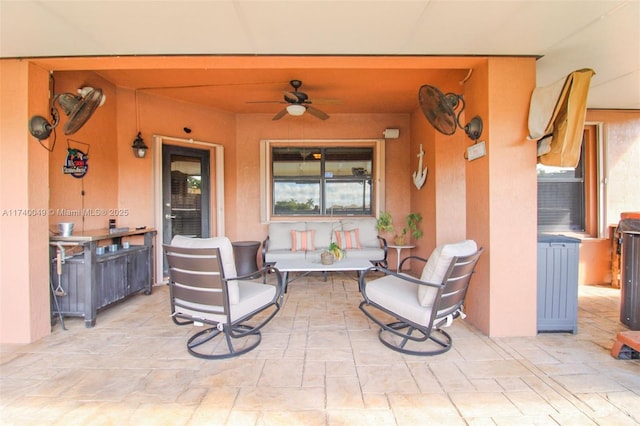 view of patio featuring ceiling fan