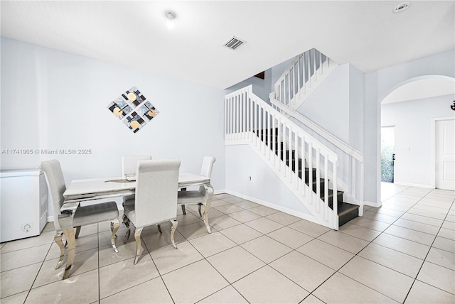 dining area with light tile patterned flooring