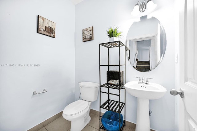 bathroom featuring tile patterned floors and toilet