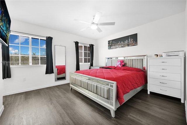 bedroom with dark wood-type flooring and ceiling fan