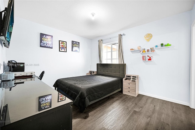 bedroom with hardwood / wood-style floors