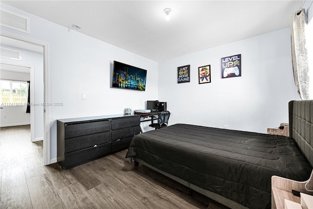 bedroom with wood-type flooring