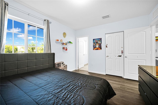 bedroom featuring dark hardwood / wood-style floors