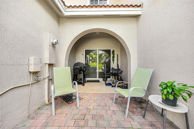 doorway to property featuring a patio