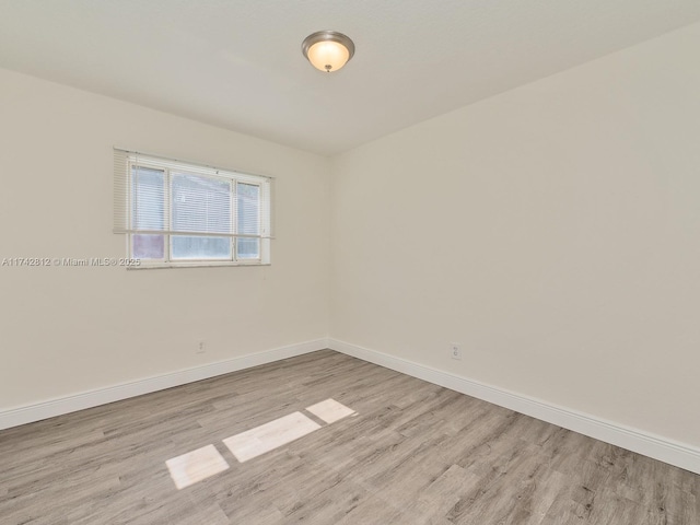 empty room with light wood-type flooring