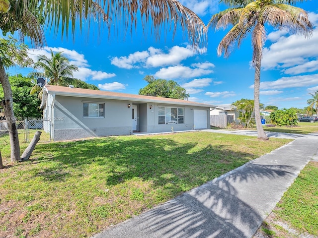 single story home featuring a front lawn