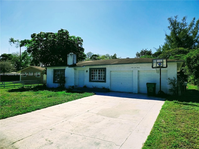 single story home with a garage, concrete driveway, a chimney, fence, and a front lawn