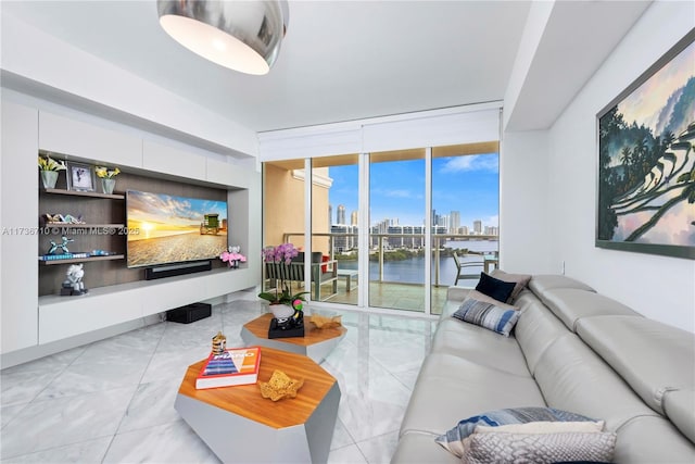 living room with floor to ceiling windows and marble finish floor
