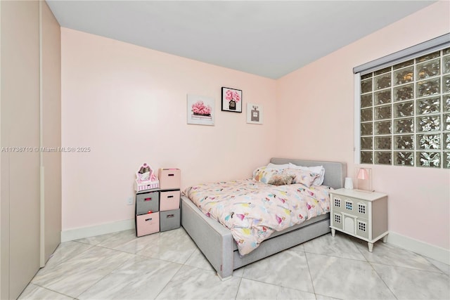 3330 NE 190th St Unit 1715, Aventura, FL 33180 - bedroom with light marble finish flooring and baseboards