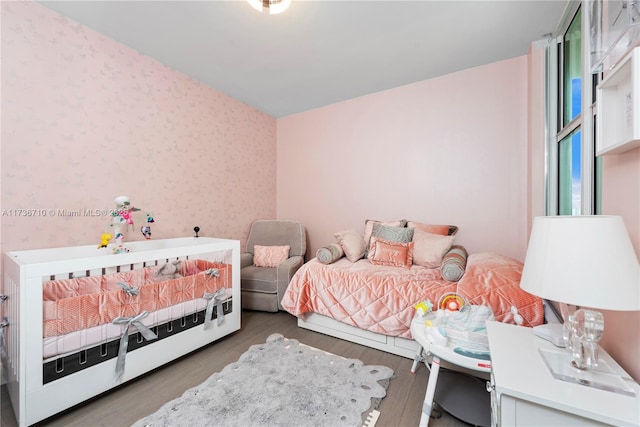 3330 NE 190th St Unit 1715, Aventura, FL 33180 - bedroom with wallpapered walls and wood finished floors