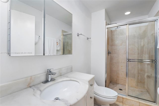 3330 NE 190th St Unit 1715, Aventura, FL 33180 - bathroom with a shower stall, toilet, vanity, and recessed lighting