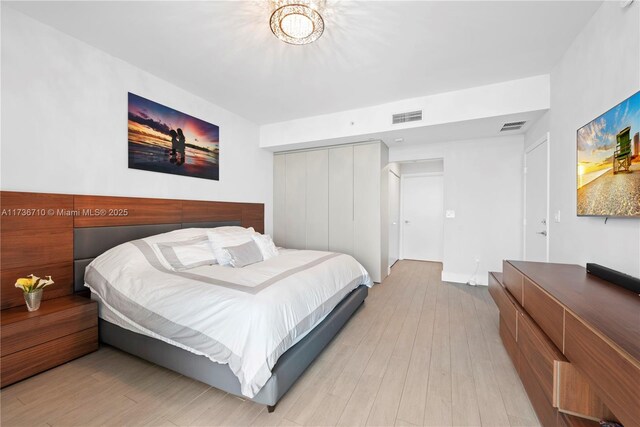 3330 NE 190th St Unit 1715, Aventura, FL 33180 - bedroom featuring wood finished floors and a closet