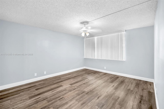 unfurnished room with a textured ceiling, ceiling fan, and wood-type flooring