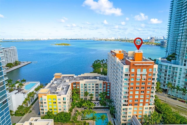 birds eye view of property featuring a water view