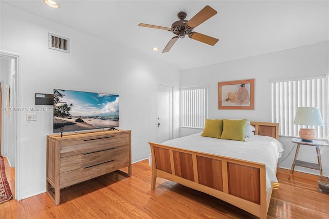 bedroom with light hardwood / wood-style floors and ceiling fan