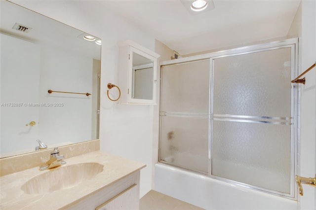 bathroom featuring recessed lighting, enclosed tub / shower combo, visible vents, and vanity