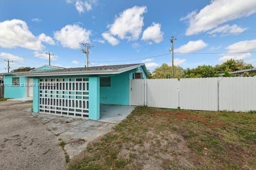 exterior space with fence and a gate