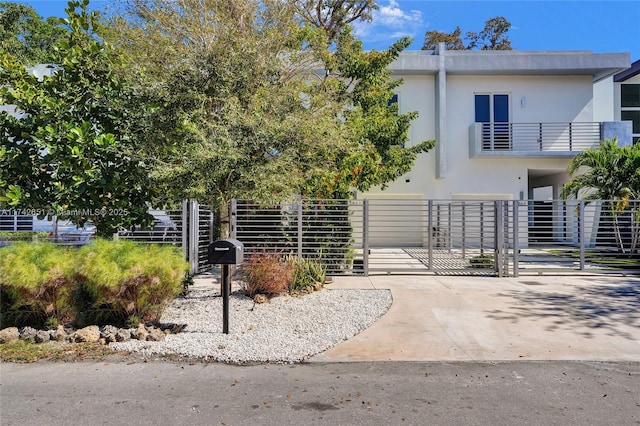 view of front of home featuring a balcony