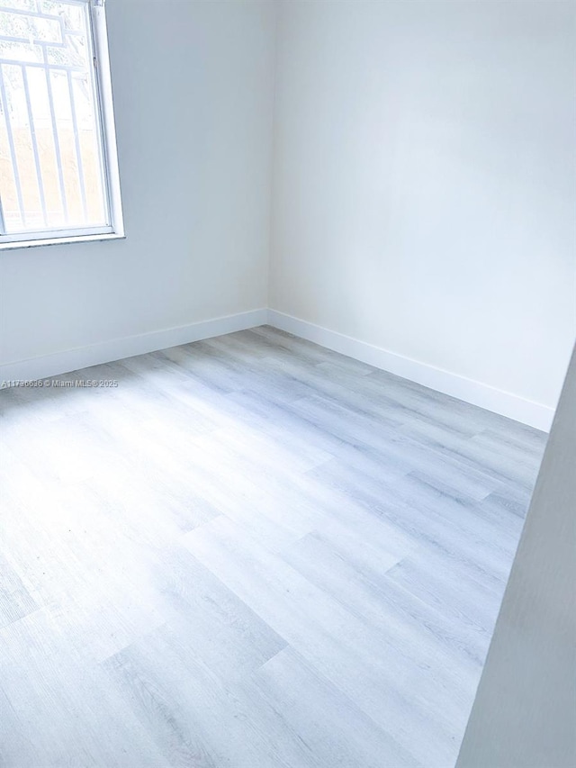 unfurnished room featuring light wood-type flooring