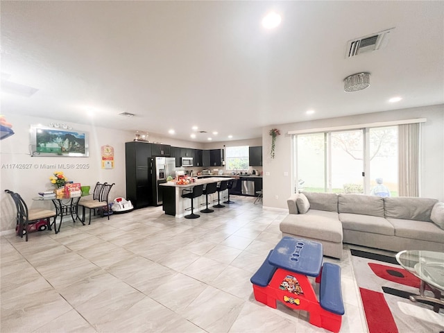 6411 Osprey Landing St, Davie, FL 33314 - living area featuring visible vents, recessed lighting, and light tile patterned floors