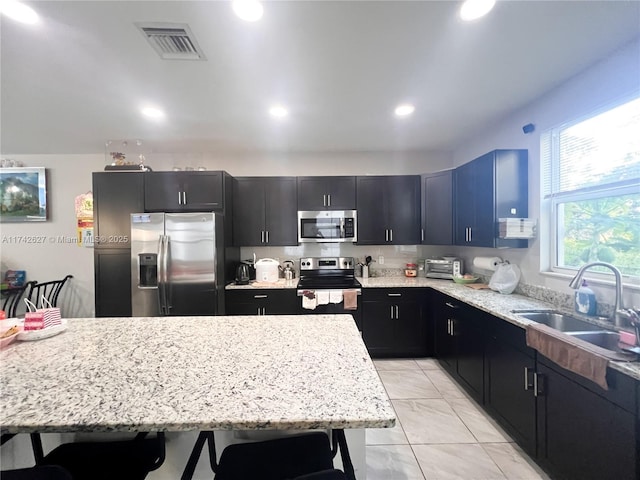 6411 Osprey Landing St, Davie, FL 33314 - kitchen featuring a sink, marble finish floor, stainless steel appliances, recessed lighting, and visible vents