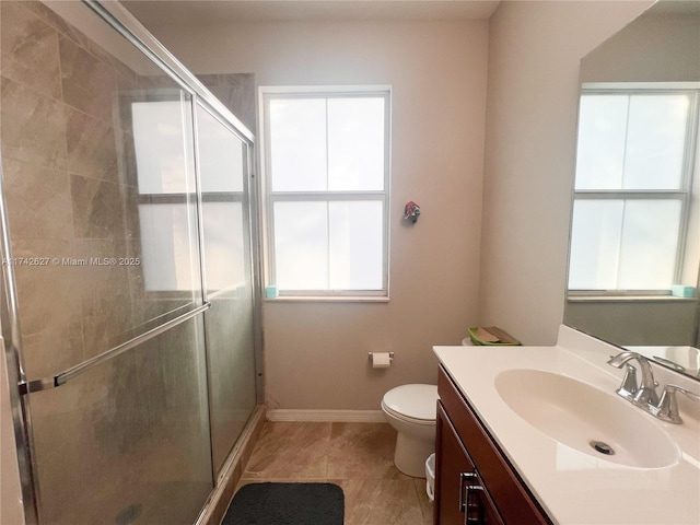 6411 Osprey Landing St, Davie, FL 33314 - bathroom featuring toilet, a shower stall, tile patterned flooring, and vanity