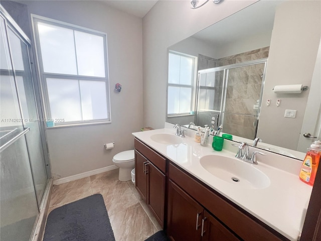 6411 Osprey Landing St, Davie, FL 33314 - bathroom featuring double vanity, a sink, a wealth of natural light, and a stall shower