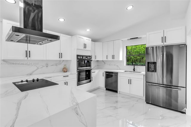 kitchen featuring island range hood, white cabinetry, sink, light stone counters, and black appliances