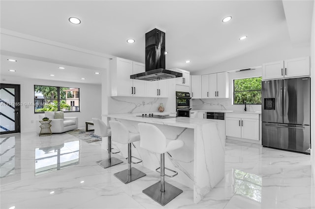 kitchen with sink, white cabinetry, light stone counters, island exhaust hood, and black appliances