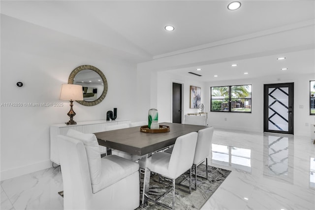 dining area with lofted ceiling