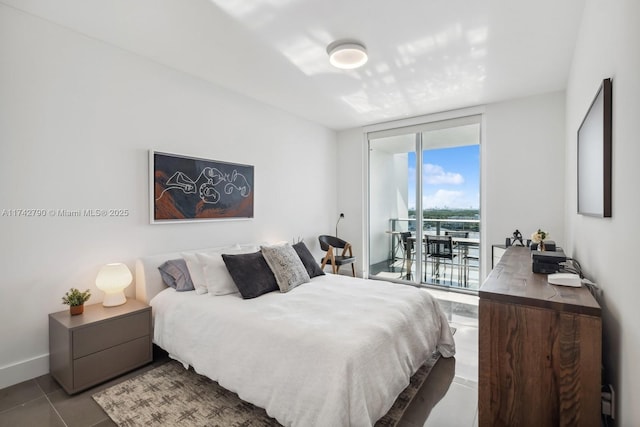 tiled bedroom with floor to ceiling windows and access to outside