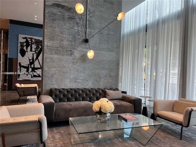 living room featuring a high ceiling