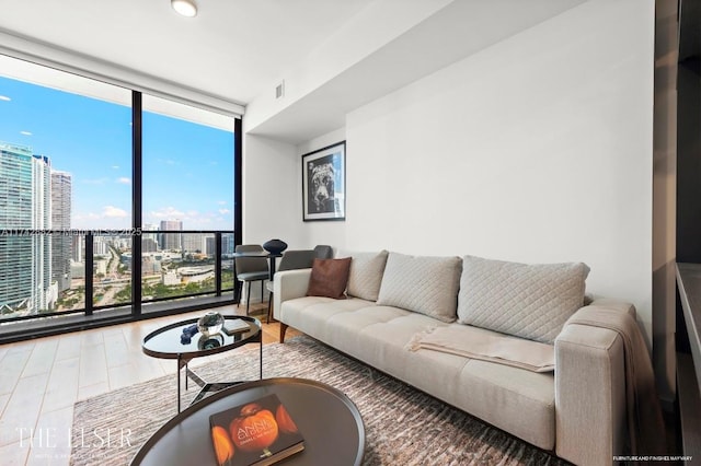 living room featuring hardwood / wood-style floors and floor to ceiling windows