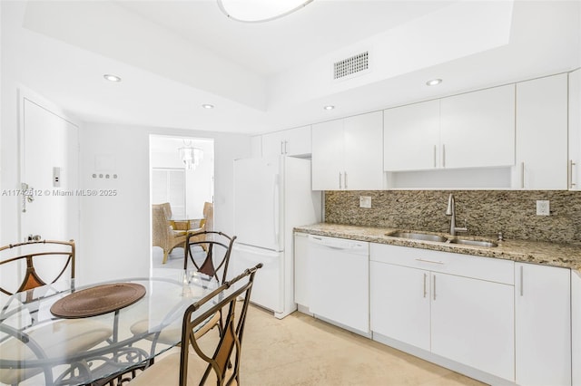 3180 S Ocean Dr Unit 511, Hallandale Beach, FL 33009 - kitchen with white appliances, decorative backsplash, white cabinets, recessed lighting, and light stone counters