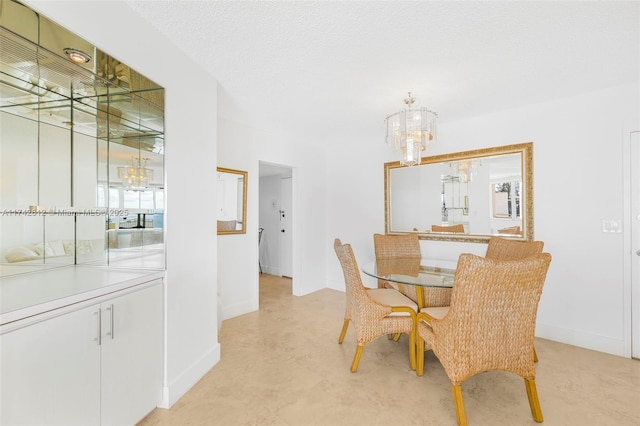 3180 S Ocean Dr Unit 511, Hallandale Beach, FL 33009 - dining space with a chandelier and baseboards